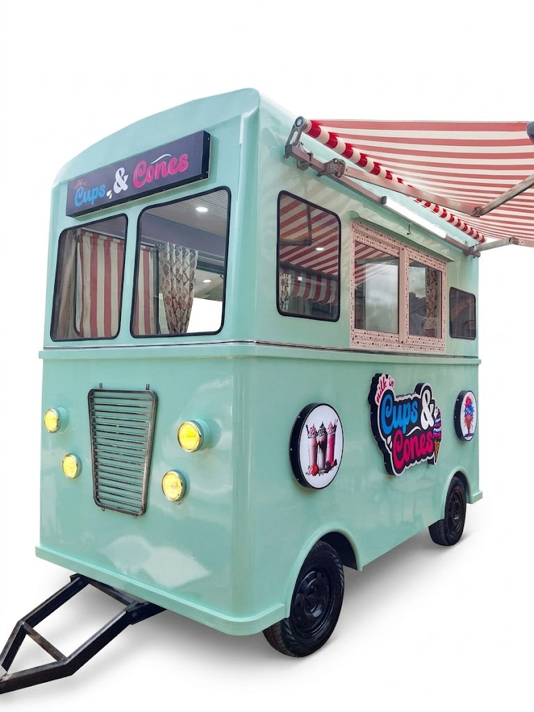 Toy ice cream truck with a red and white striped awning on a white background